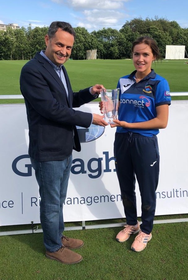 Shane Matthews presents the Player of the Match Award to Abbie Leckey